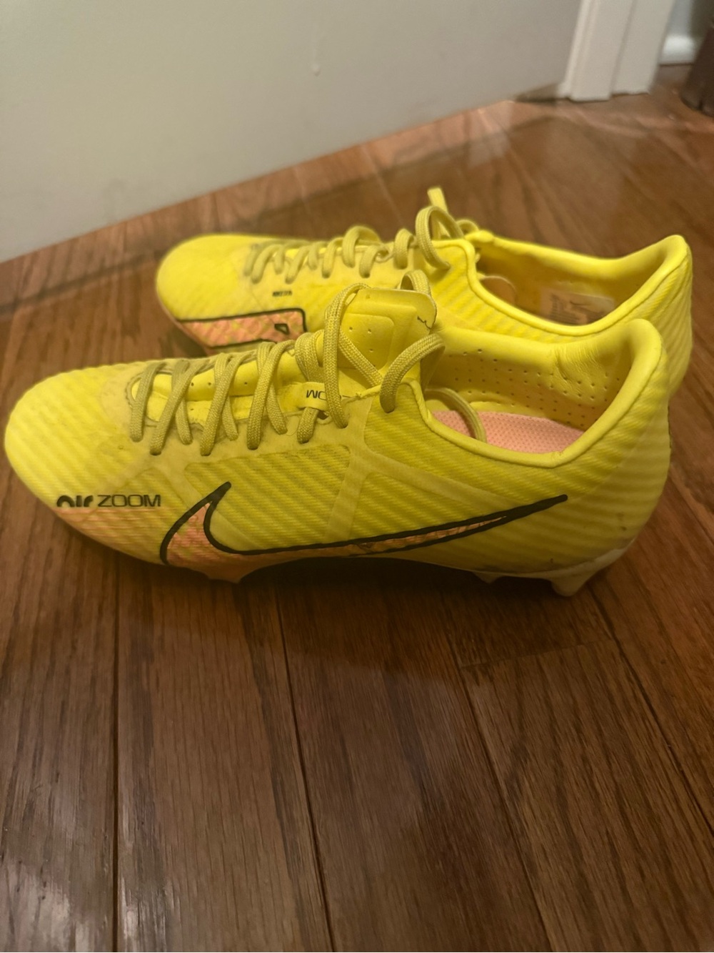 Nike Yellow Soccer Cleats with Black Swoosh and Pink Accent